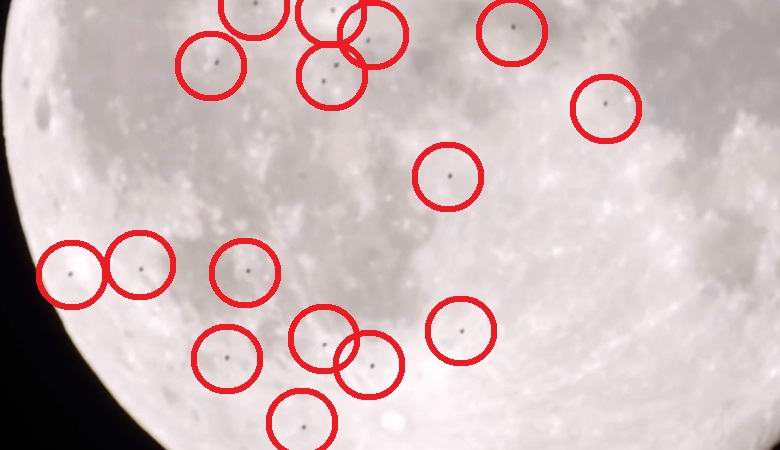 Um enxame de objetos obscuros voou contra o pano de fundo da lua cheia